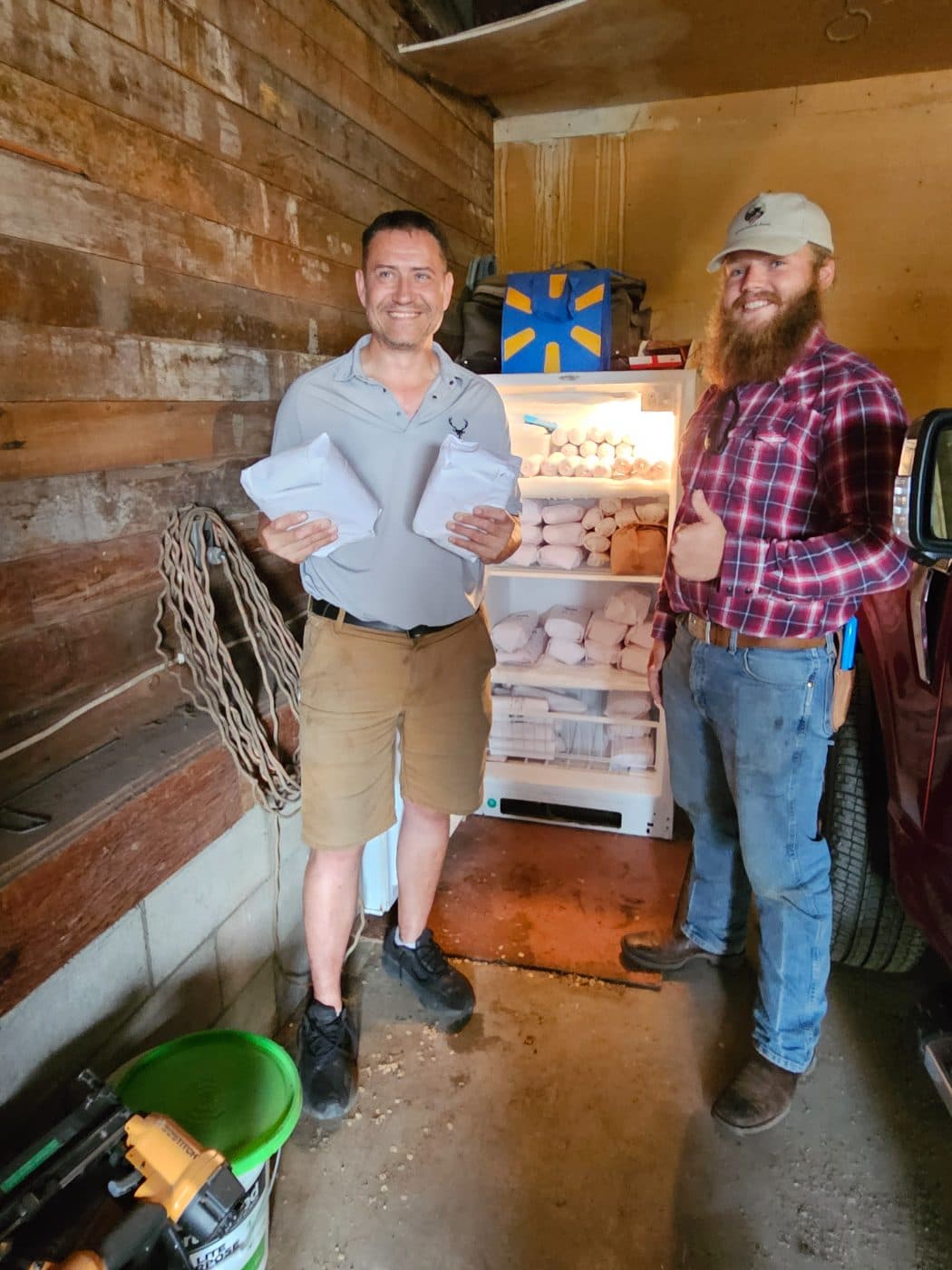 The Kindt family at the farm freezer with pork orders